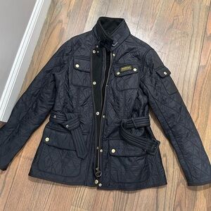 Navy blue Barbour jacket.